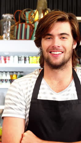 Male-waiter-standing-with-arms-crossed