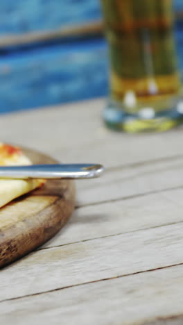 Delicious-pizza-on-wooden-table