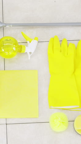 Yellow-rubber-gloves-and-cleaning-supplies