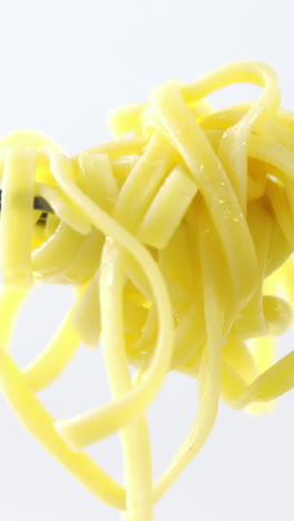 Close-up-of-cooked-pasta-on-fork