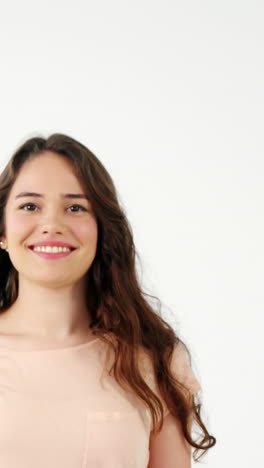 Portrait-of-smiling-woman-holding-a-shopping-bag