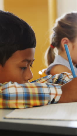 School-kids-studying-in-classroom