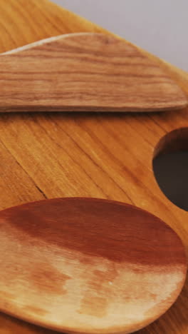 Wooden-spoon-and-spatula-on-wooden-board