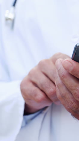 Doctor-using-mobile-phone-in-hospital