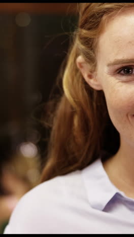 Portrait-of-teacher-smiling-in-classroom