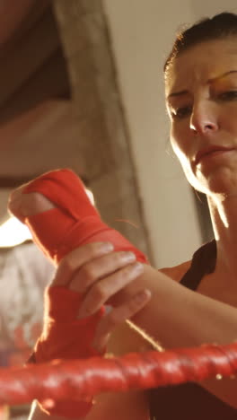 Female-boxer-wearing-red-strap-on-wrist