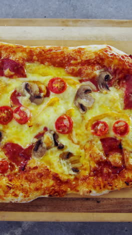 Baked-pizza-on-wooden-board