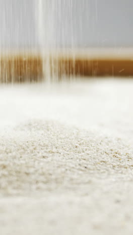 Close-up-of-pouring-sand