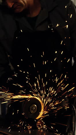 Welder-working-at-work-shop