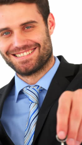 Portrait-of-businessman-holding-keys