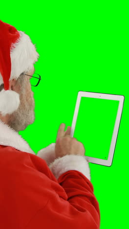 Santa-claus-using-digital-tablet