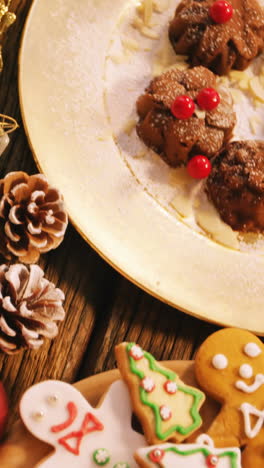 Close-up-of-various-christmas-desserts-and-gifts