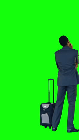 Businessman-standing-with-luggage