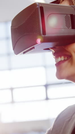 Female-business-executive-using-the-virtual-reality-headset