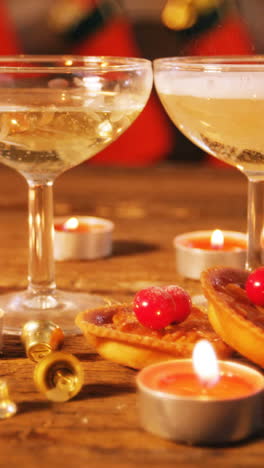 Wine-glasses-with-christmas-decorations-on-wooden-table