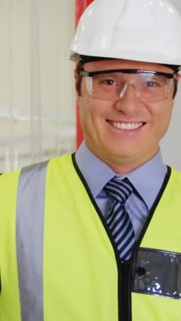 Portrait-of-inspection-officer-holding-clipboard