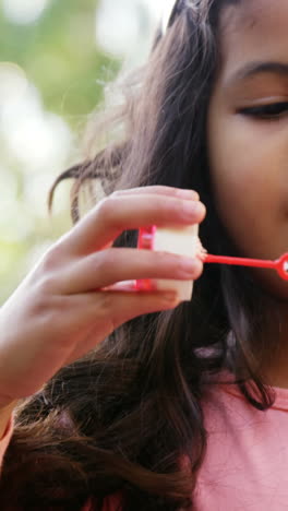 Girl-blowing-soap-bubbles