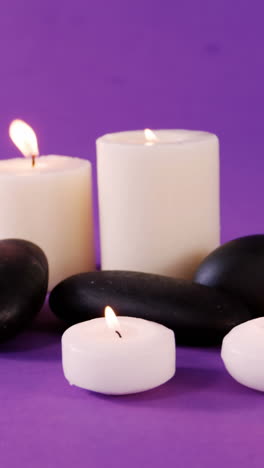 Pebbles-and-candle-on-table