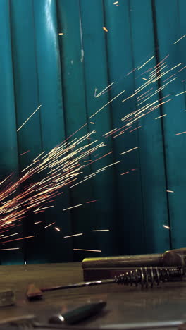 Female-welder-working-at-work-shop