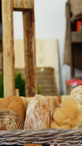 Woman-purchasing-bread-at-bakery-section