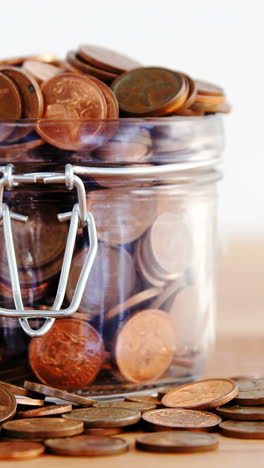 Close-up-of-coins-in-bottle