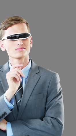 Businessman-in-virtual-video-glasses-using-digital-screen