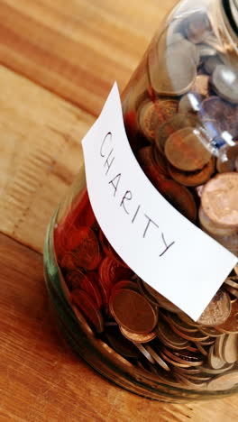 Close-up-of-coins-in-bottle-and-heart