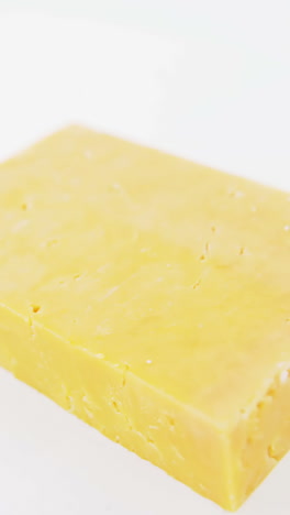 Slice-of-cheese-on-white-background