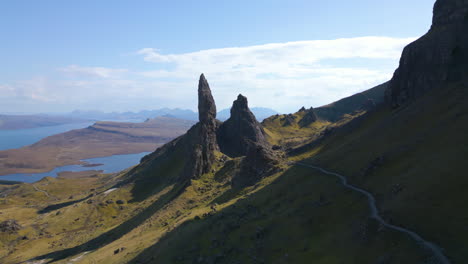 Aerial-flying-towards-The-Old-Man-of-Storr,-Sound-of-Raasay-in-background