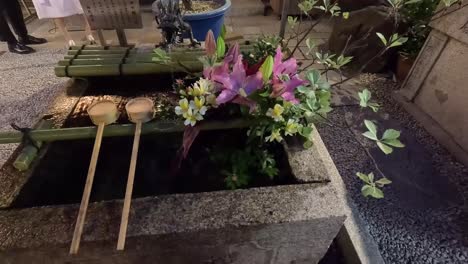 Hishaku-Wooden-Ladle-At-Chuzuya-Inside-A-Shinto-Shrine-Pavilion-In-Japan