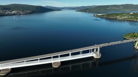 Aerial-showcasing-architecture-and-structure-of-Nordhordland-Bridge-with-Osterfjord-in-the-background