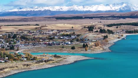 Amazing-aerial-view-of-Lake-Tekapo-and-snow-on-mountain-range