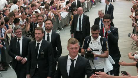 Real-Madrid-players,-such-as-Toni-Kroos,-greet-fans-during-the-celebration-of-their-15th-UEFA-Champions-League-title-victory-in-Madrid,-Spain