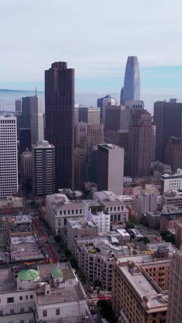 Vertical-Aerial-View-of-Downtown-San-Francisco-Cityscape-Skyline-on-Misty-Morning,-California-USA