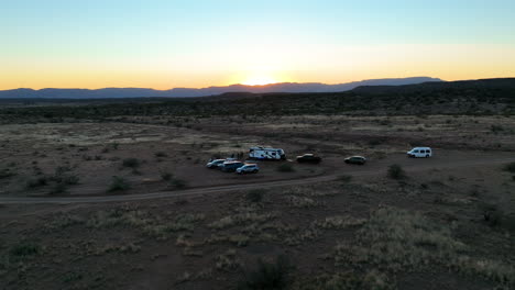 Aerial-View-Of-Vehicles-And-Camper-Van-In-Sedona,-Arizona-At-Sunset---Drone-Shot