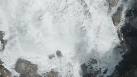 Majestic-waterfall-in-Owen-Sound,-Canada,-cascading-down-rocks-with-powerful-force