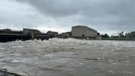 River-Donau-near-peak-level,-during-flood-in-bavaria,-barrage-bergheim-power-plant-near-ingolstadt