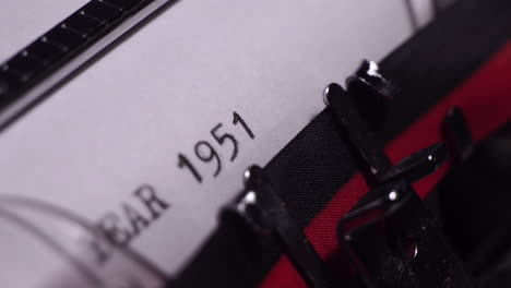 Year-1951,-Typing-on-White-Paper-in-Vintage-Typewriter,-Close-Up