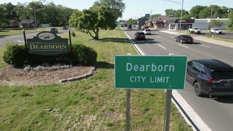 Welcome-to-Dearborn,-Michigan-sign-and-Dearborn-city-limit-sign-from-above-view-with-traffic-and-stable-video