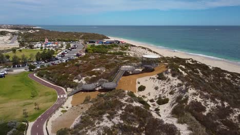 Aerial-rise-up-clip-of-beach-lookout-tower-and-staircases-rising-over-dunes---Amberton-Beach-lookout