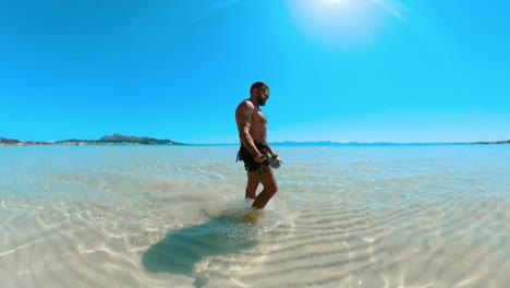 man-walking-on-the-seashore