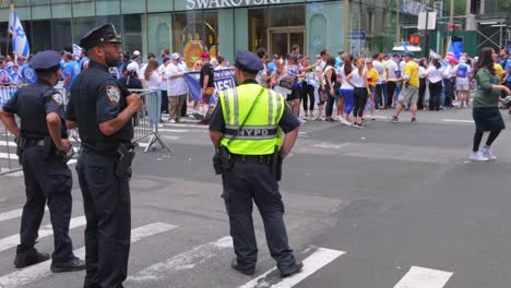 A-street-level-view-of-the-Israel-Day-Parade-in-New-York-City-on-a-sunny-day