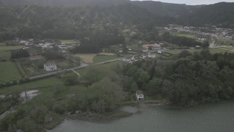 Scenic-aerial-view-of-Sete-Cidades,-Portugal,-showcasing-lush-greenery-and-tranquil-waters