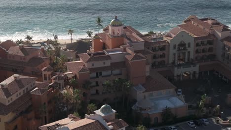 Hacienda-del-Mar-Los-Cabos-ocean-view,-luxury-resort---tilt-down-ascending-aerial-reveal