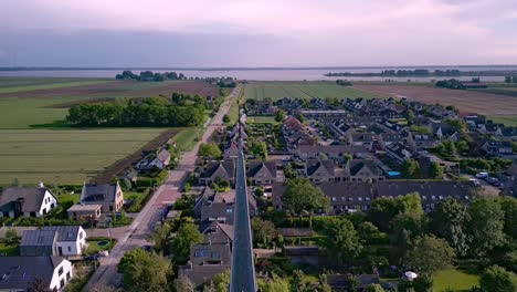 The-village-church-of-Zuid-Beijerland-in-the-Netherlands,-founded-in-1933,-reveal-shot