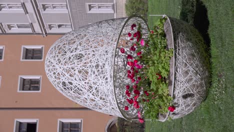 Easter-egg-decoration-with-flowers-on-Cathedral-Square-by-St-Jakob-Cathedral-during-Easter,-Innsbruck,-North-tyrol,-Austria