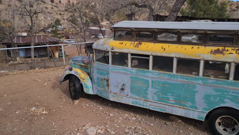 Rusty-American-Bus-From-1950s-in-Decay-on-Vehicle-Graveyard,-Jerome-Ghost-Town,-Arizona-USA