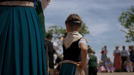 Children-dancing-traditional-maypole-dance-at-Bavarian-May-Festival-Celebration