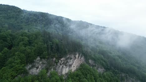 Clouds-On-Foggy-Forested-Mountain-In-Lepsa,-Vrancea-County,-Romania