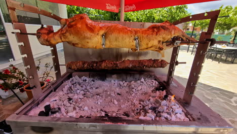 Traditional-Greek-Lamb-on-the-Spit-under-hot-charcoal,-cooking-slowly